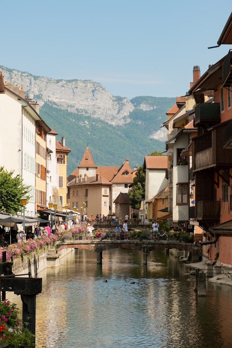A river running through a small town next to tall buildings