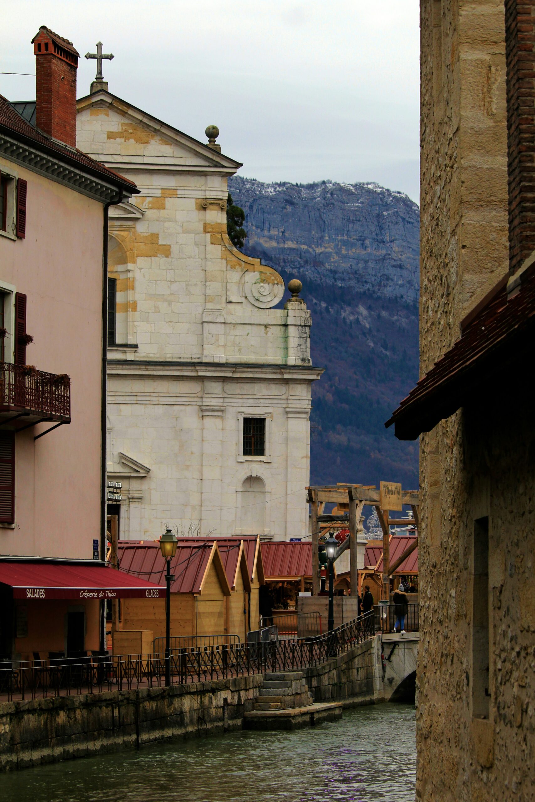 A river running through a small town next to tall buildings