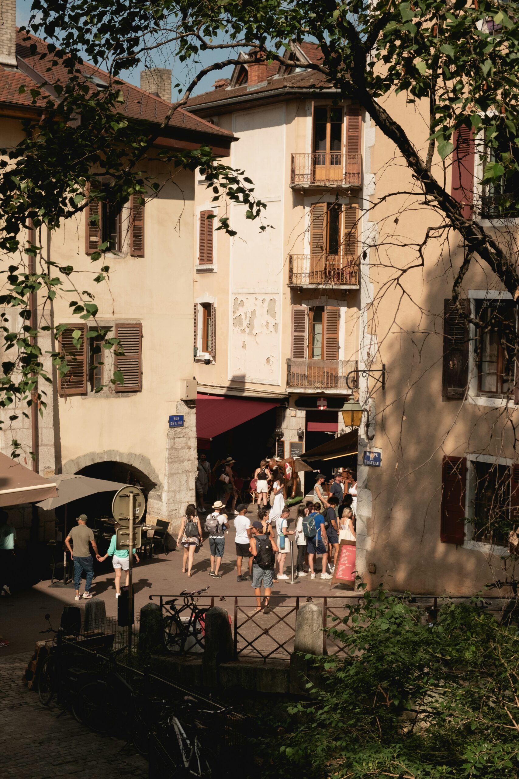A river running through a small town next to tall buildings